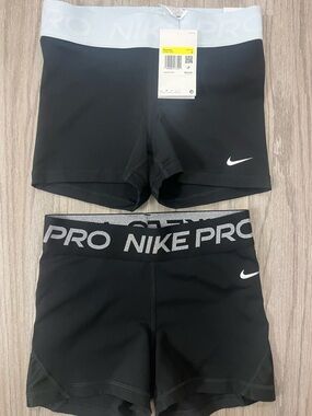 Nike Pro shorts bundle women’s Size S
baby blue NWT & sparkley black worn once